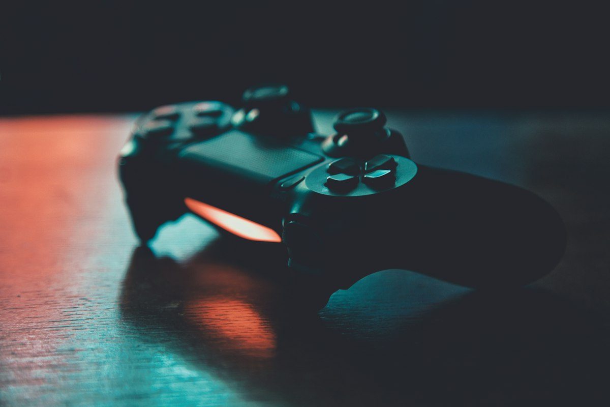 Game controller lit by teal light