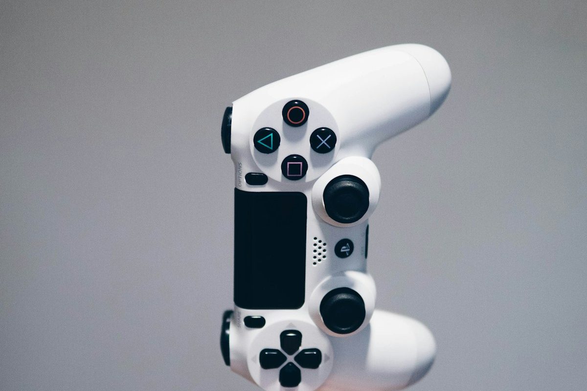 White game controller on a grey surface